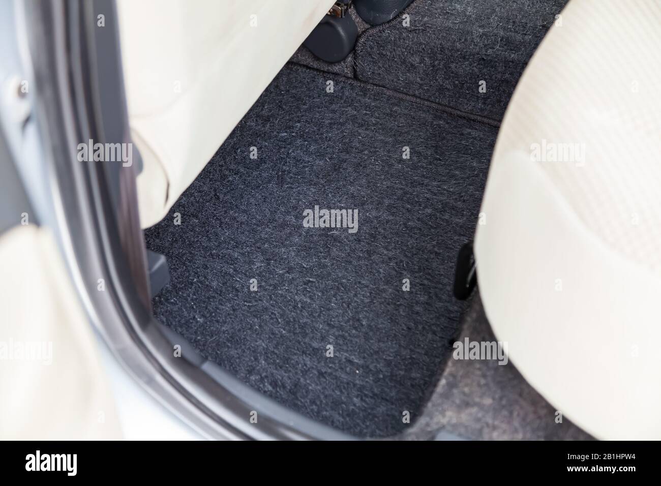 Clean Car Floor Mats Of Black Carpet Under Rear Passenger Seat In