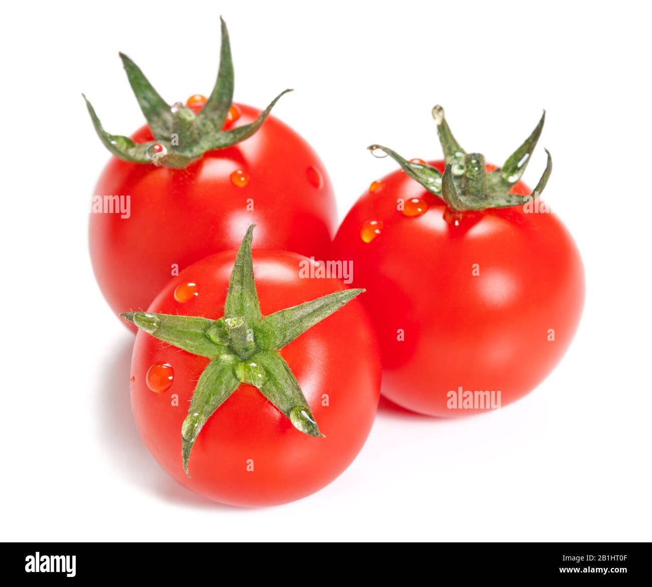 Three ripe tomato with drops isolated on white background Stock Photo ...