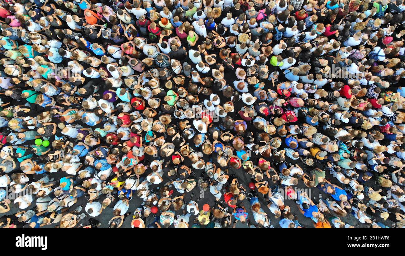 Aerial. People crowd background. Mass gathering of many people in one  place. Top view Stock Photo - Alamy