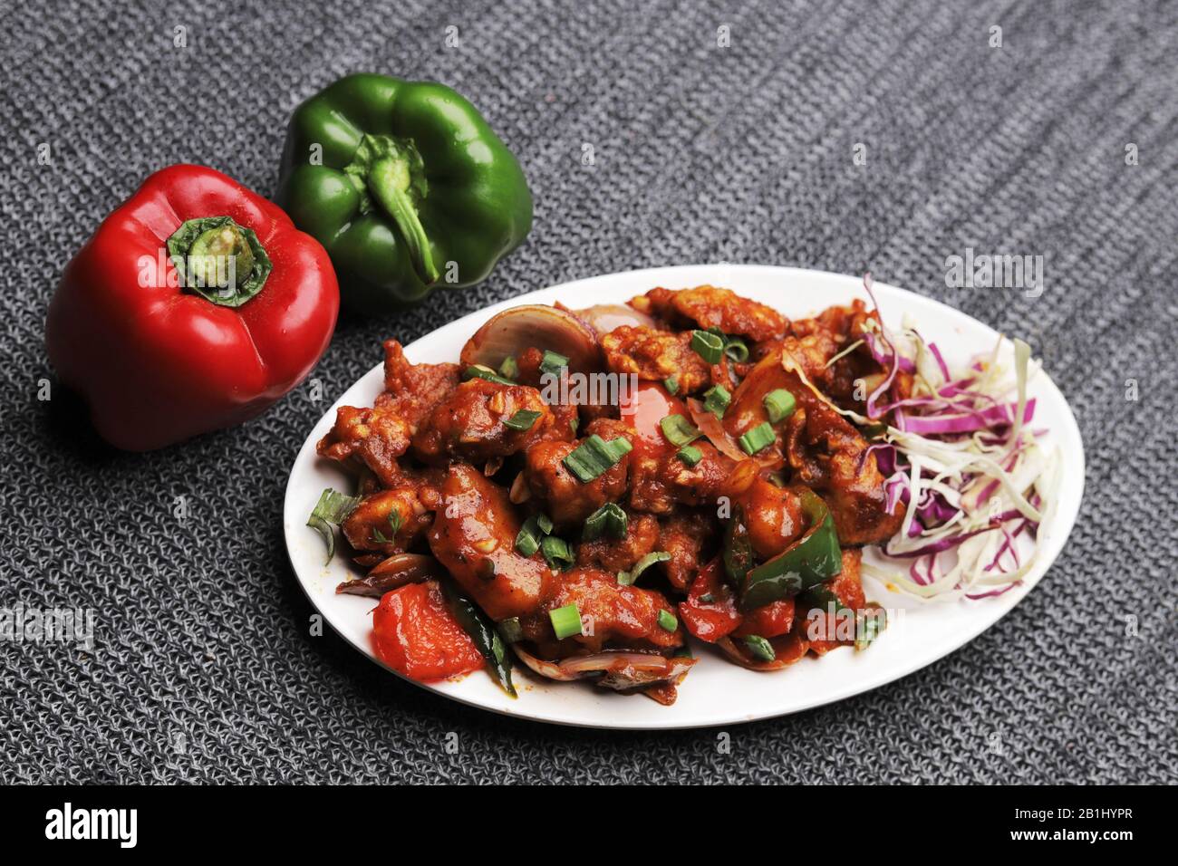 Dragon chicken. Chicken strips marinated, fried and sautéed in a spicy and tangy sauce Stock Photo