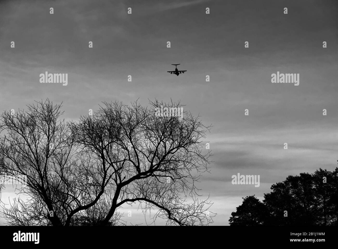 Airplane flying in Sky Stock Photo - Alamy