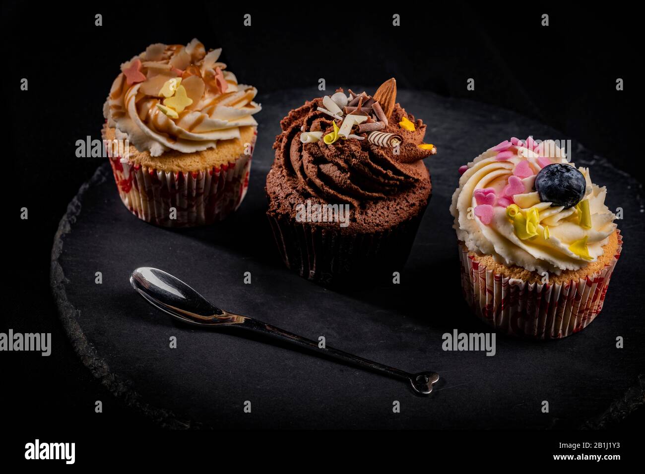 Three different cupcakes row Stock Photo