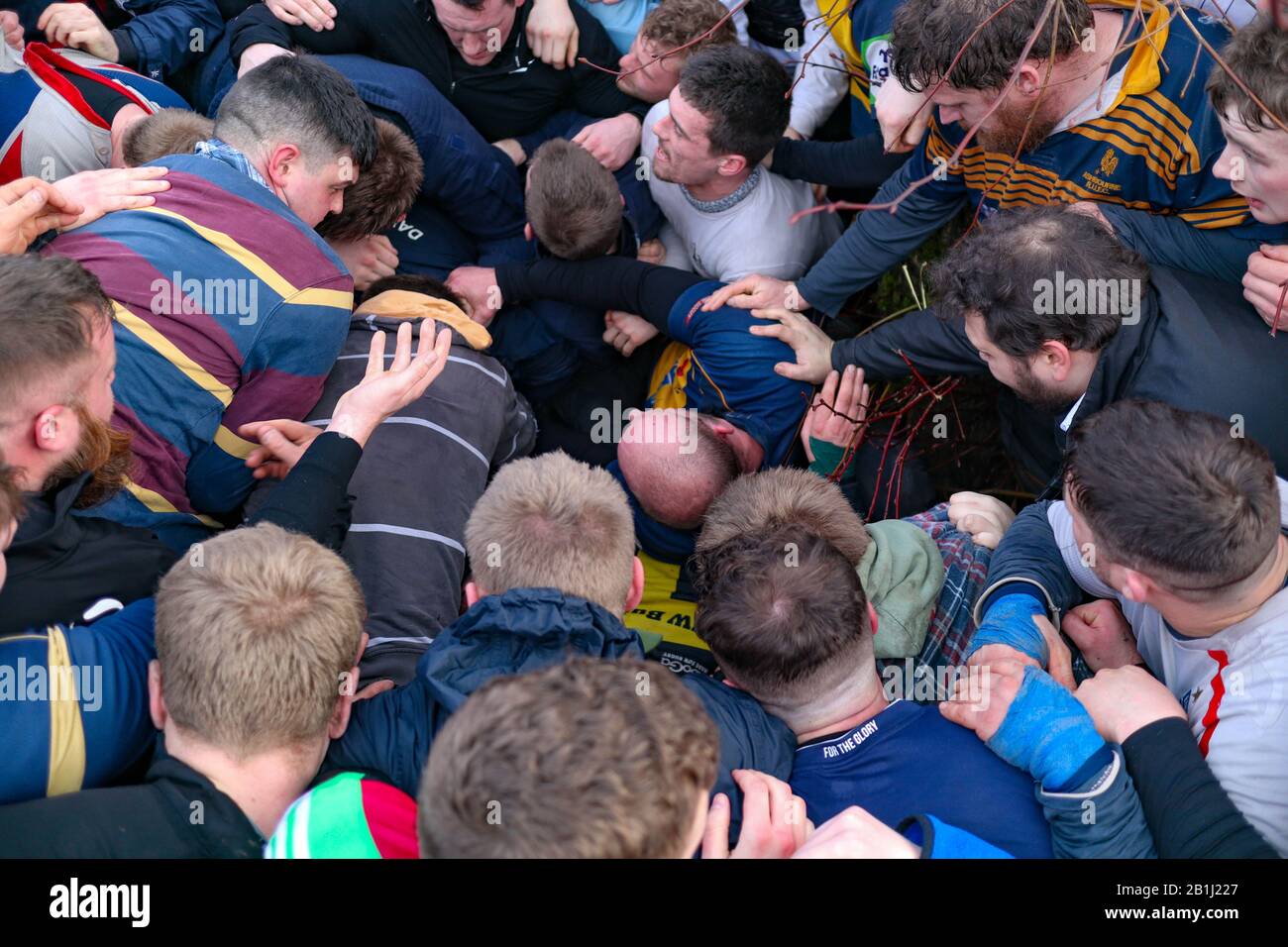 Ashbourne, UK. 25th Feb, 2020. The first day of the two day Shrovetide Football Game in the market town of Ashbourne, Derbyshire. The game is played with two teams, the Up'Ards and the Down'Ards. There are two goal posts 3 miles (4.8 km) apart, one at Sturston Mill (where the Up'Ards attempt to score), other at Clifton Mill (where the Down'Ards score). Penelope Barritt/Alamy Live News Stock Photo