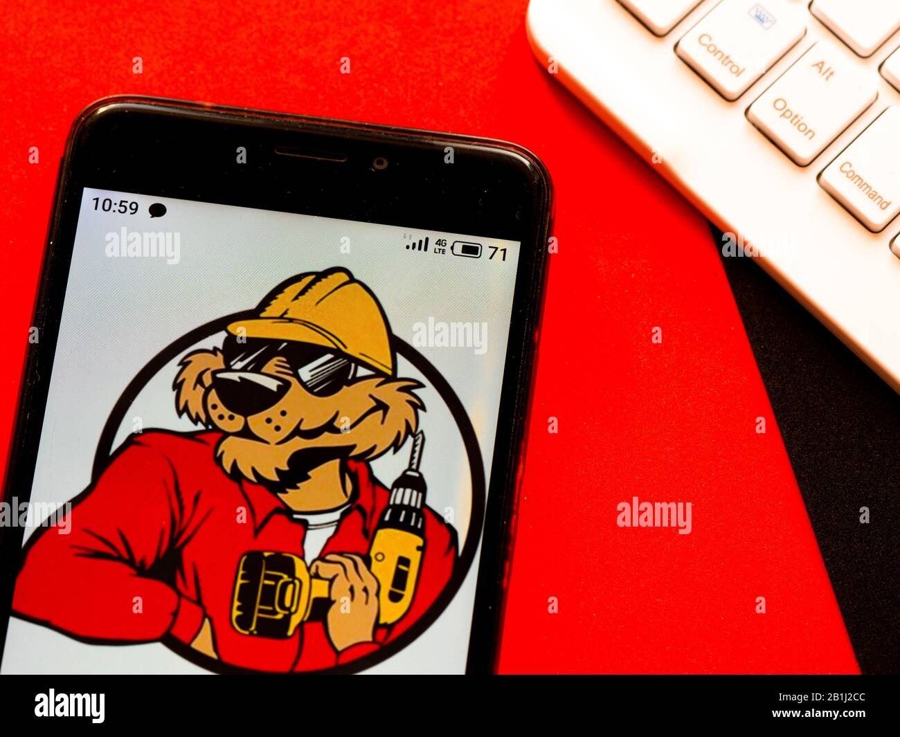 In this photo illustration the Acme Tools logo is seen displayed on a smartphone Stock Photo Alamy