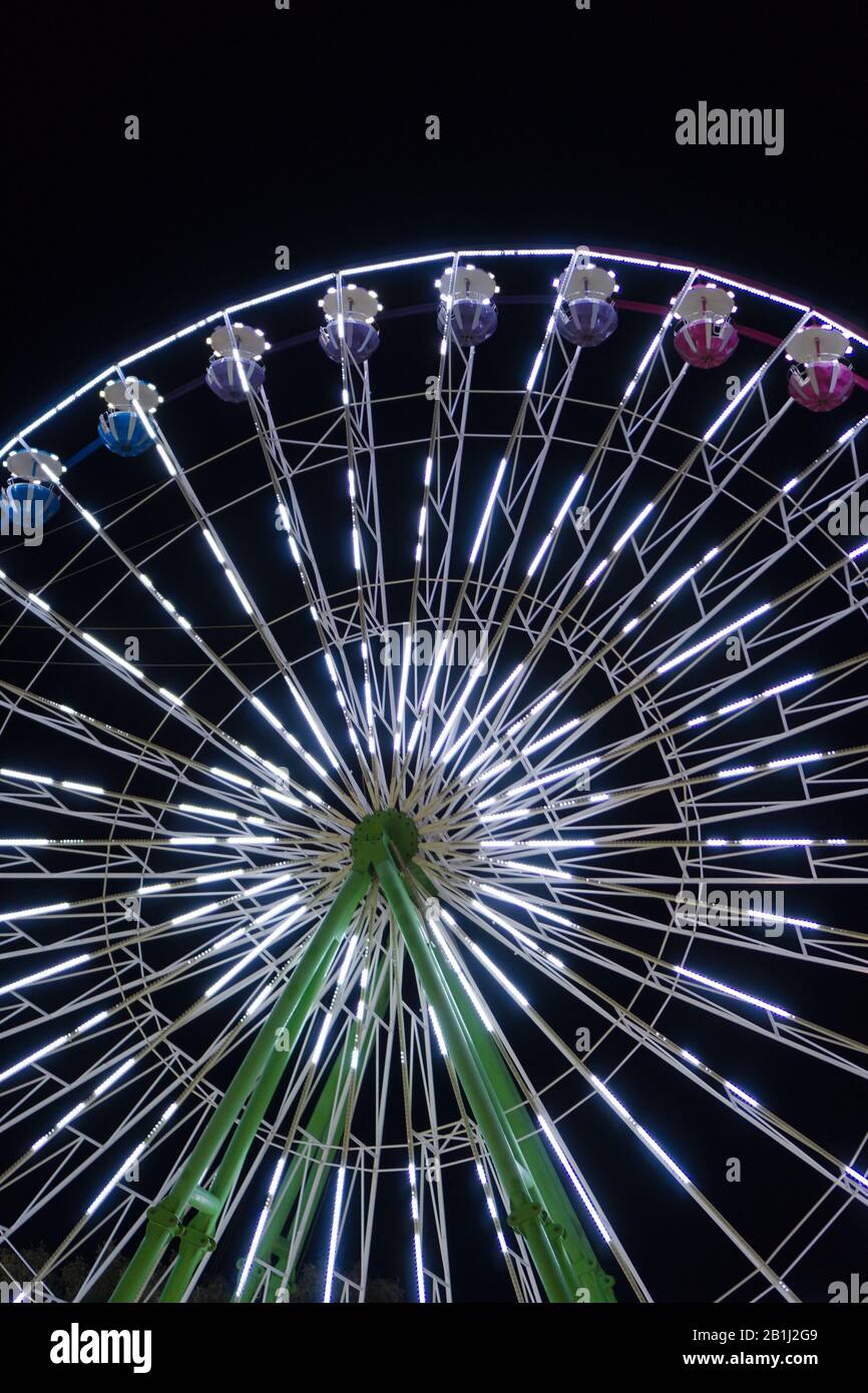 Colorful ferris wheel in the city park at night Stock Photo - Alamy
