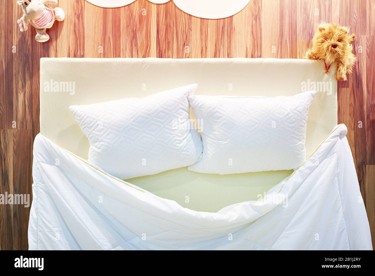 Pillows and blanket on the bed Stock Photo