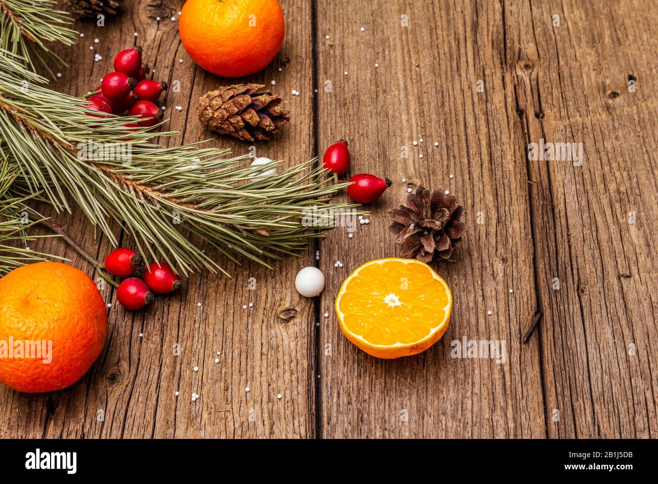 Spirit Christmas background. Fresh mandarins, dogrose berries, candies