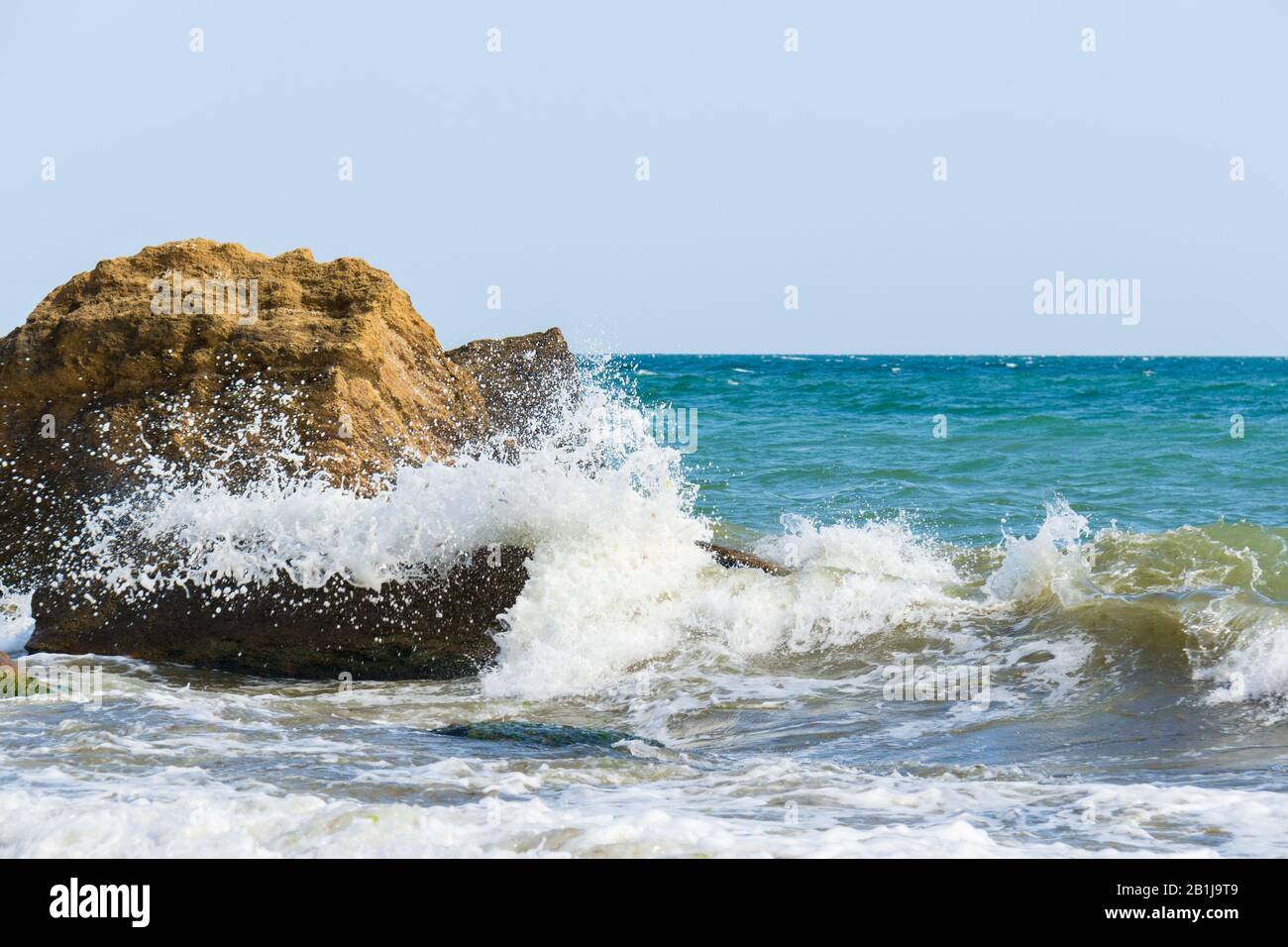 Sea splashing on big stones hi-res stock photography and images - Alamy