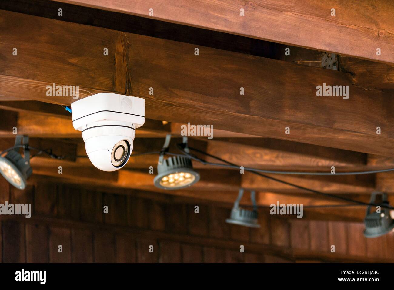 Close up of CCTV security camera on the ceiling in the building. Record