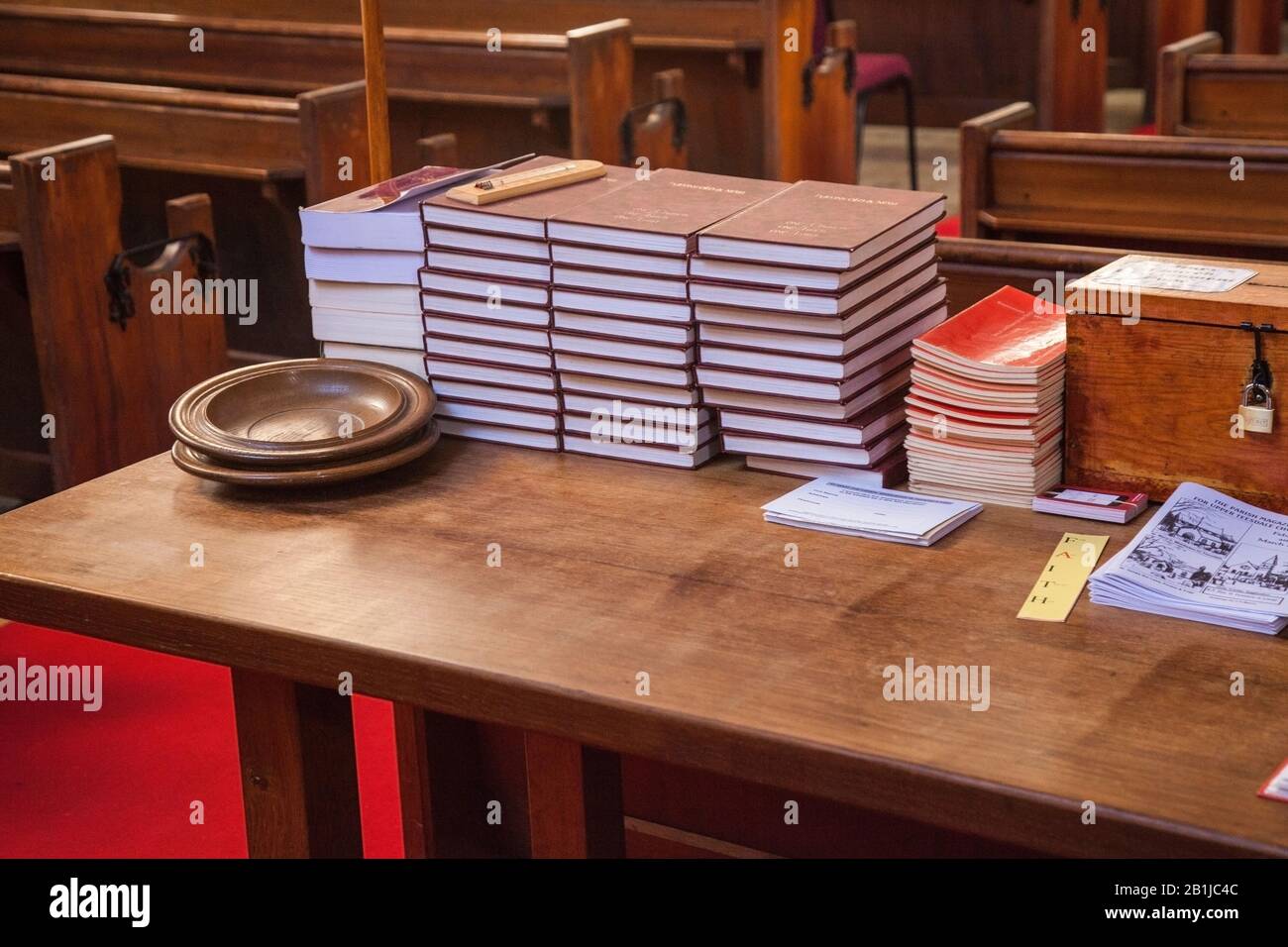 St Marys church in Middleton in Teesdale,England,UK showing the interior with its collection plates and hymn books Stock Photo