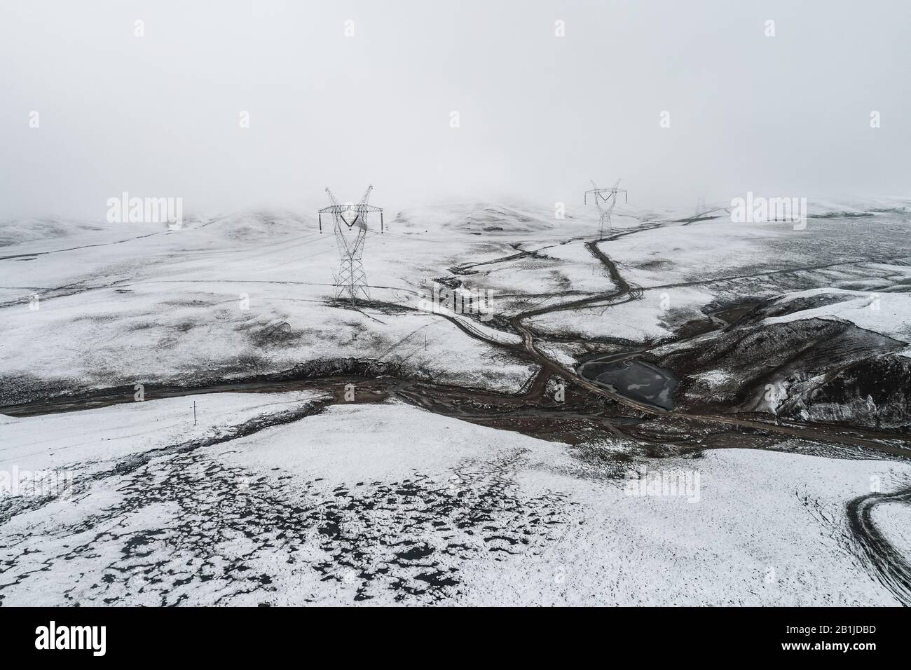 electricity pylon on the mountain which covered with snow Stock Photo ...
