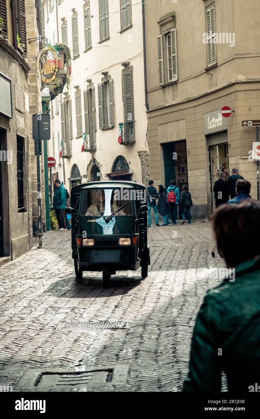 Piaggio Ape mini pick-up in the streets of Bergamo, Lombardy, Italy Stock Photo