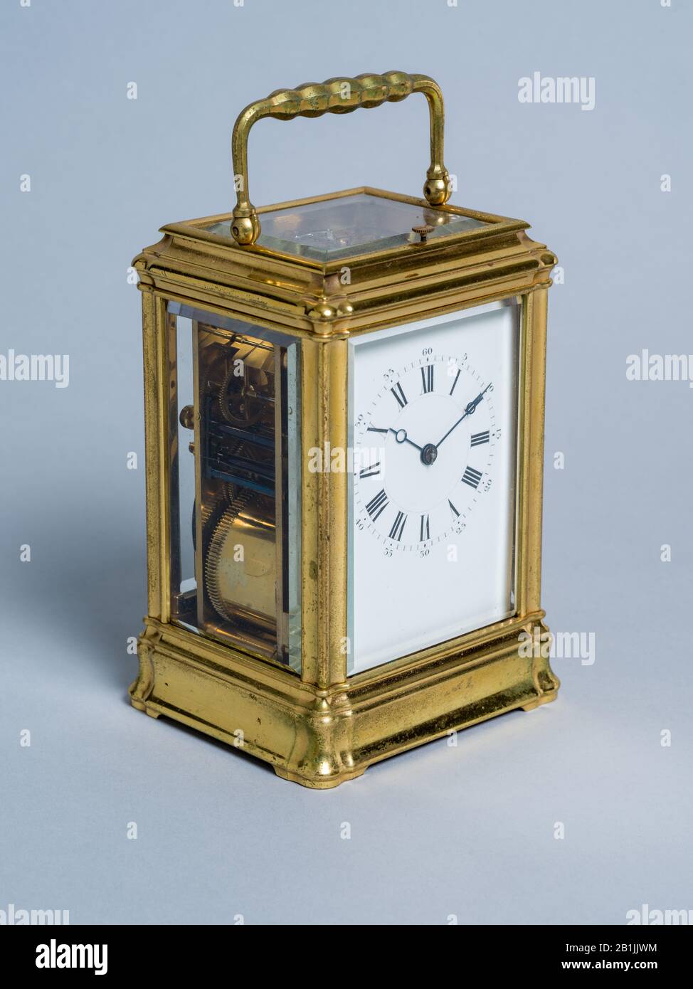 Antique Carriage Clock, Classic French Timepiece, on Grey Background