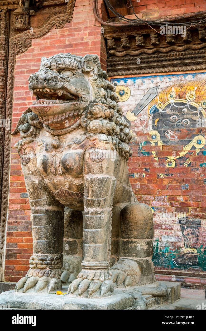 Statue in front of Taleju Temple at Durbar Square in Lalitpur (Patan), Kathmandu valley, Nepal Stock Photo