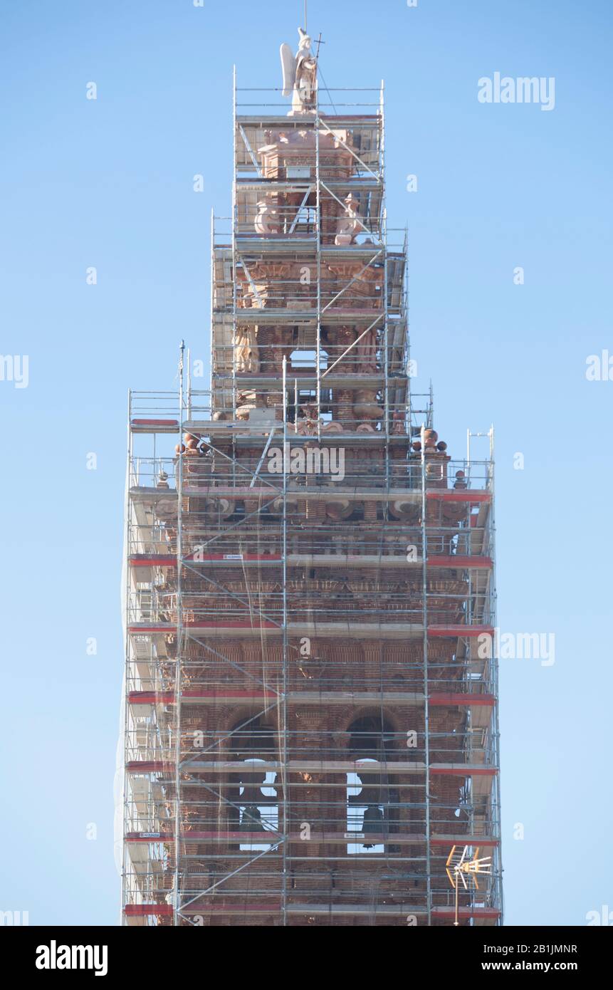 Church Tower covered with scaffoldings. Heritage preservation concept Stock Photo