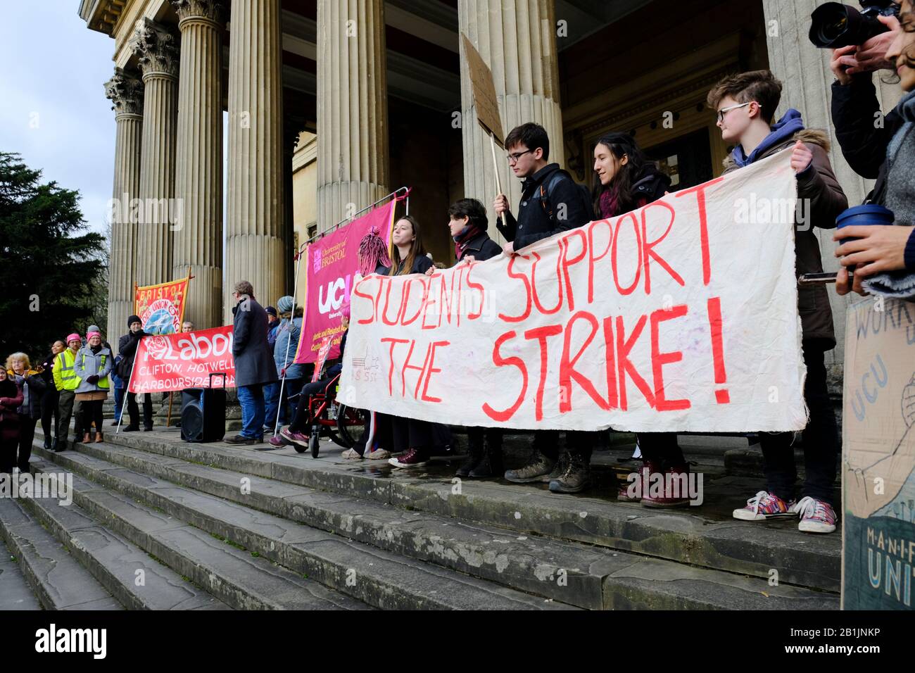 Bristol, UK. 26th Feb, 2020. The University and College Union (UCU) lecturer strike was supported by students and other local groups. University lecturers have commenced a series of strikes protesting changes to their Pension Scheme and working conditions. A group gathered outside the Victoria Rooms, and after speeches and protests the rally passed peacefully down Park Street and dispersed on College Green. Credit: Mr Standfast/Alamy Live News Stock Photo