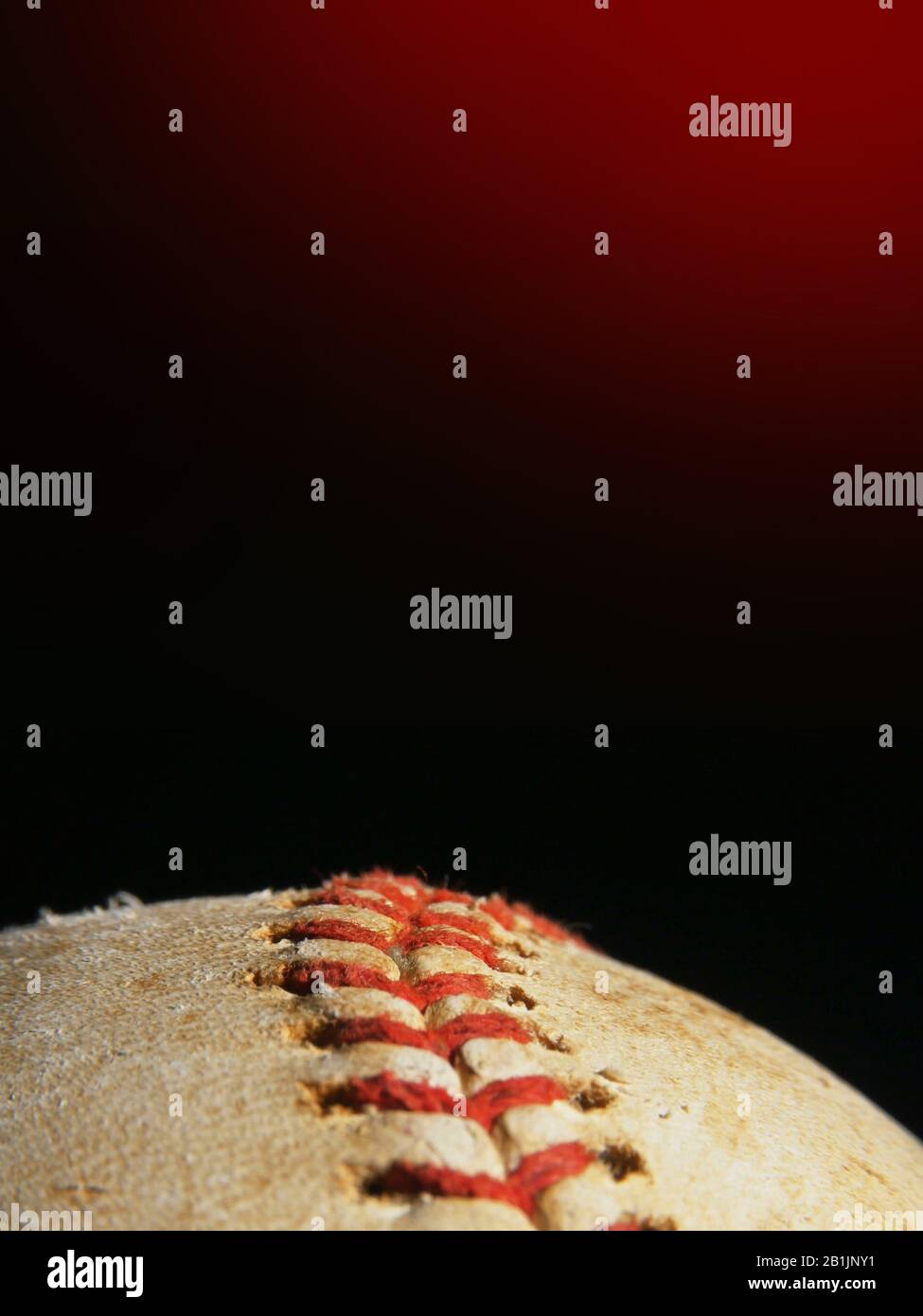 Old used baseball macro over black background with copyspace, vertical layout Stock Photo
