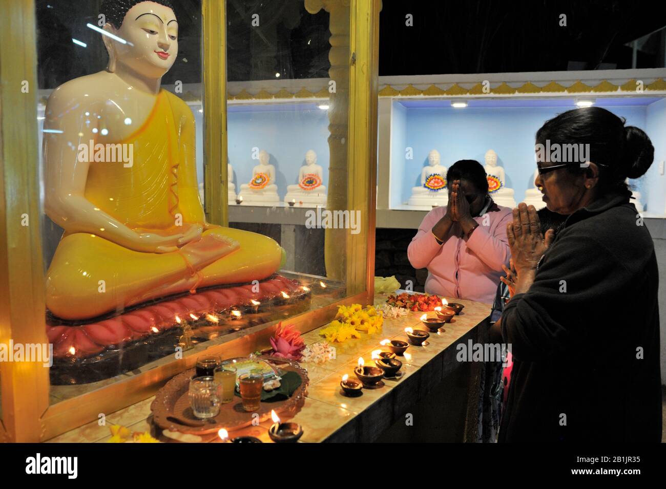 Sri Lanka, Adam’s peak, Dalhousie village monastery, buddhist devotees praying at night Stock Photo