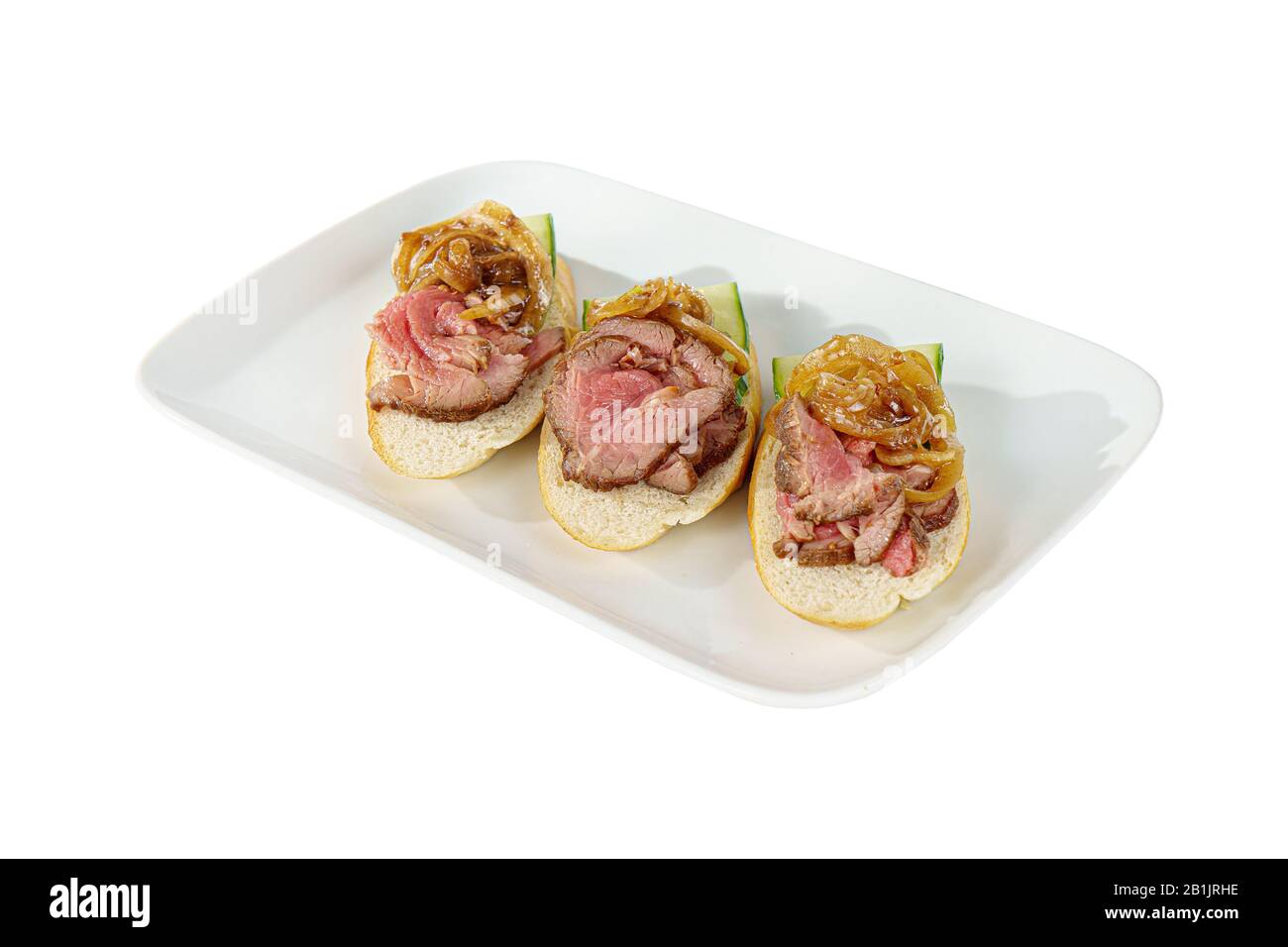 Cold appetizers sandwiches with marinated roast beef, pickled onions