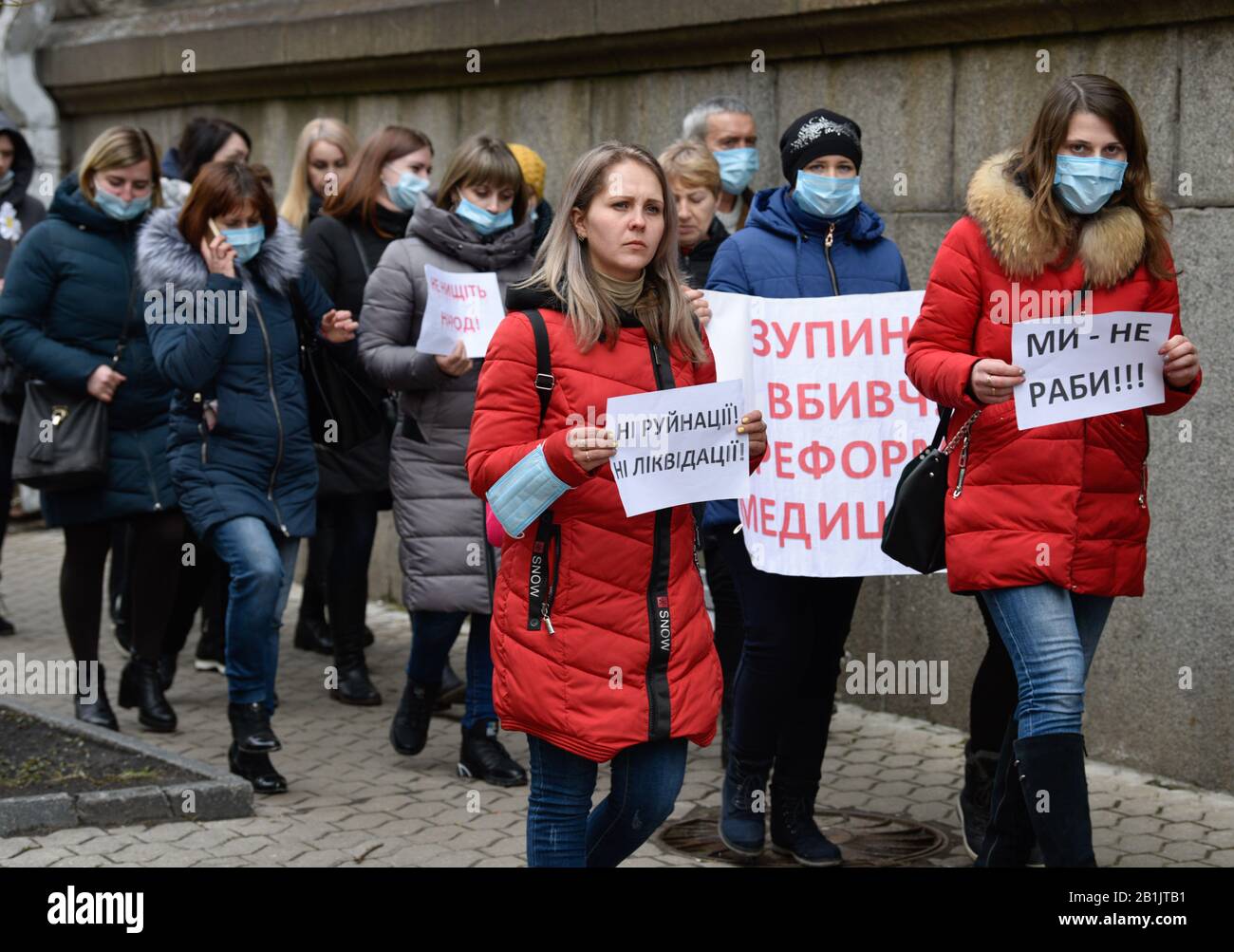 Kiev, Ukraine. 26th Feb, 2020. Protesters hold placards during the demonstration.Doctors protest against medical reform, difficult working conditions, low salaries and the closure of medical facilities. Credit: SOPA Images Limited/Alamy Live News Stock Photo