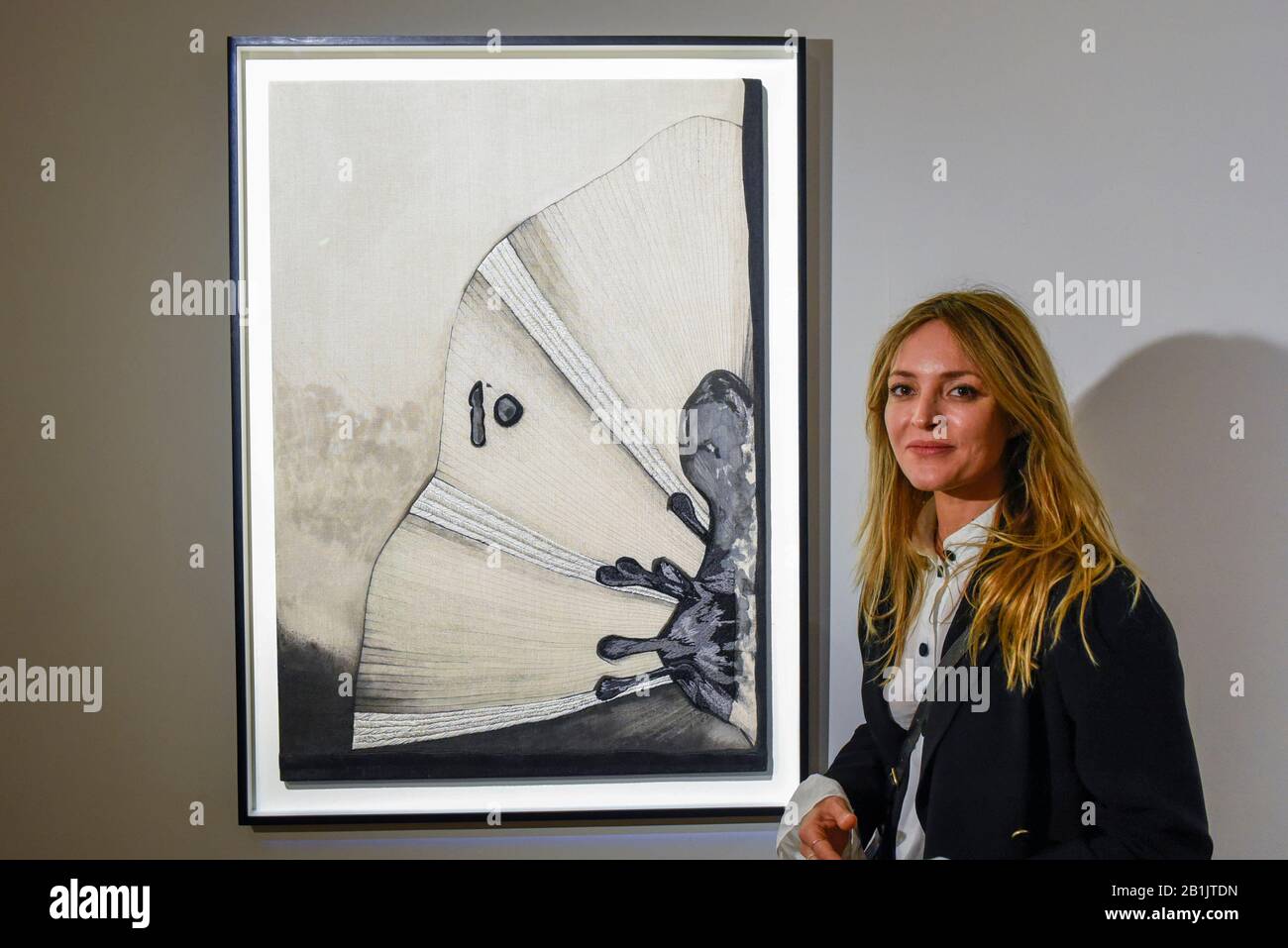London, UK. 26 February 2020. Artist Carolina Mazzolari poses with her work called "Void", 2019 (Starting price GBP3,000). Preview of "Human Touch", an exhibition of one-of-a-kind artworks by international contemporary artists in collaborations with stitchers in British prisons. In association with the charity Fine Cell Work, the artworks are on show at Sotheby's New Bond Street 26 February to 3 March 2020. Credit: Stephen Chung / Alamy Live News Stock Photo