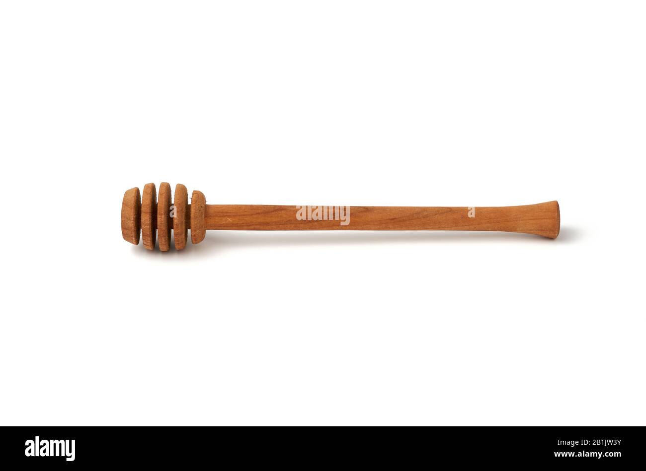 wooden stick for stirring honey isolated on a white background, close ...