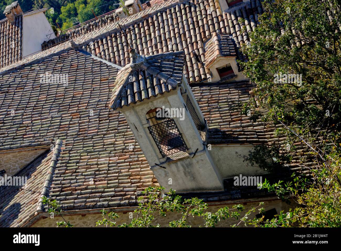 San Marino, San Marino - October 19, 2019: Tiled sloping roof with tiled bell tower. Stock Photo