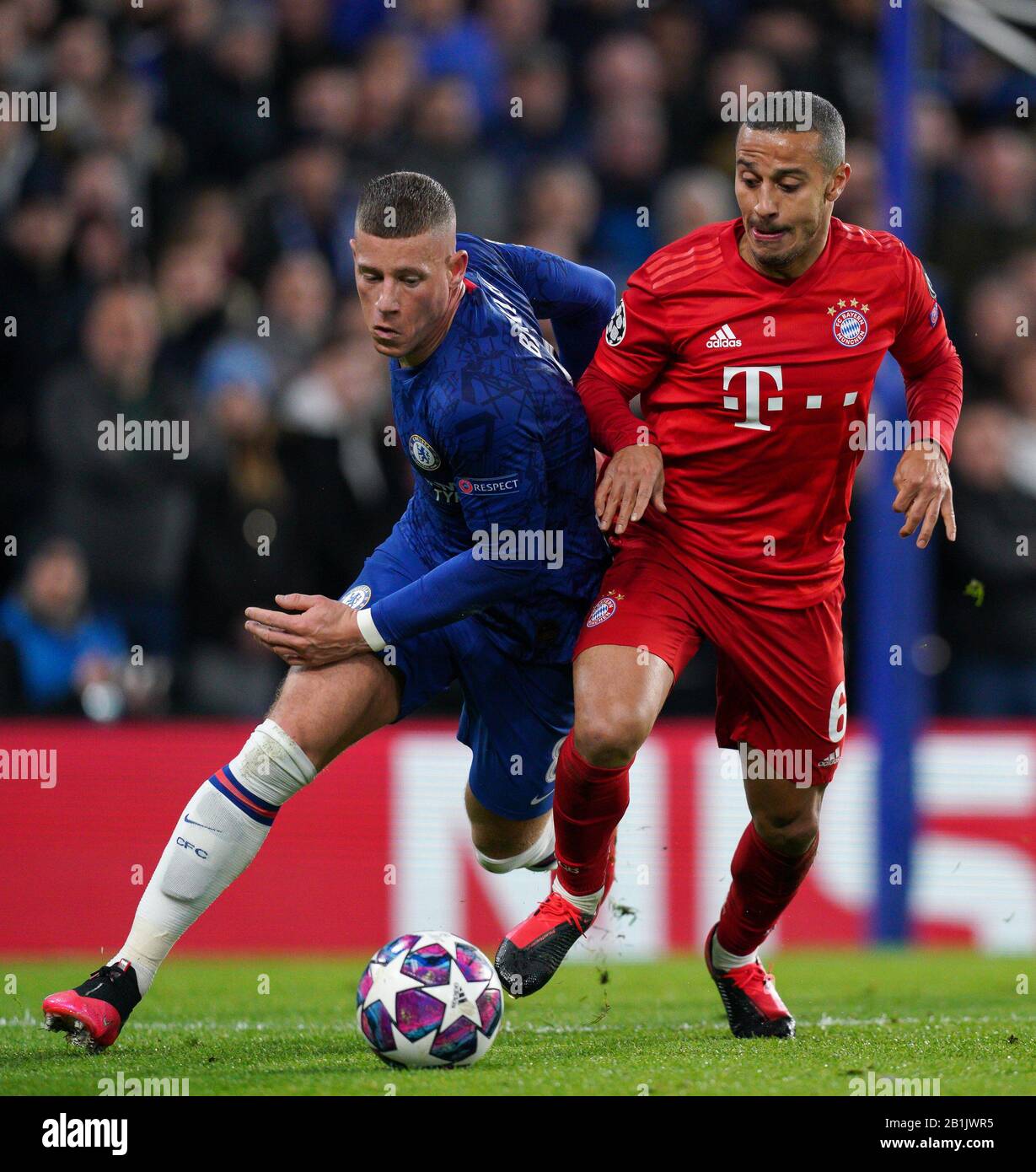 London, UK. 25th Feb, 2020. Ross Barkley of Chelsea & Thiago Alc‡ntara of Bayern Munich during the UEFA Champions League round of 16 1st leg match between Chelsea and Bayern Munich at Stamford Bridge, London, England on 25 February 2020. Photo by Andy Rowland. Credit: PRiME Media Images/Alamy Live News Stock Photo