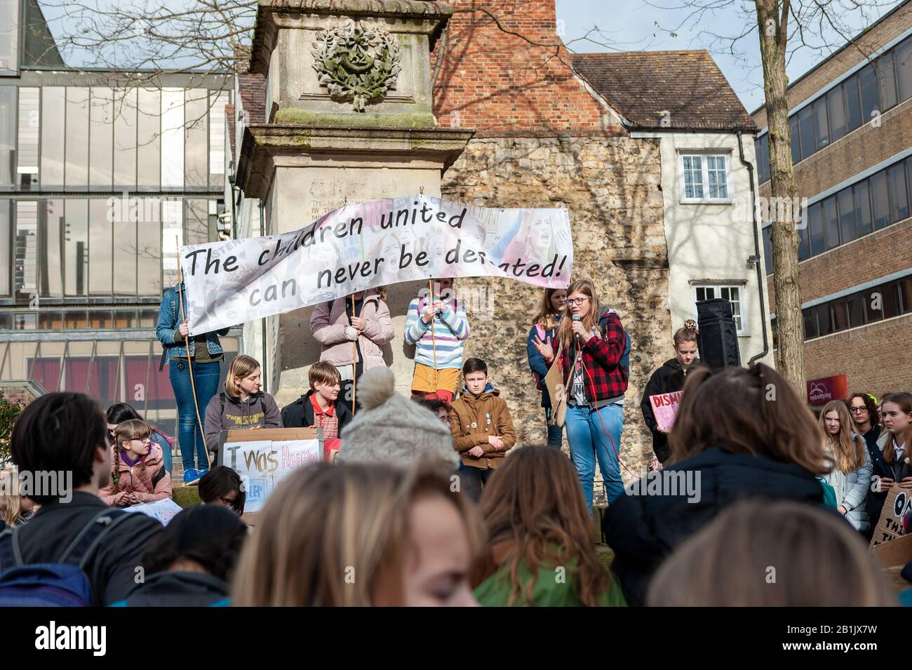 Protesters calling for unity in the fight against Climate Change, while EJ Fawcett addresses the crowd at the Valentine's Day Youth Climate Strike in Oxford, United Kingdom, on the anniversary of the first UK youth strike for climate in 2019. Stock Photo