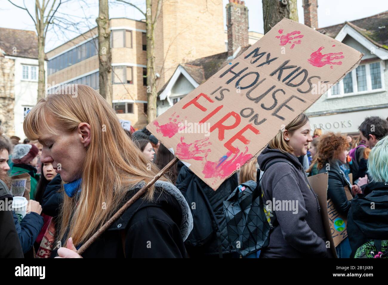 A parent expressing her concern for the impact of Climate Change on her childrens' future at the Valentine's Day Youth Climate Strike in Oxford, United Kingdom, on the anniversary of the first UK youth strike for climate in 2019. Stock Photo