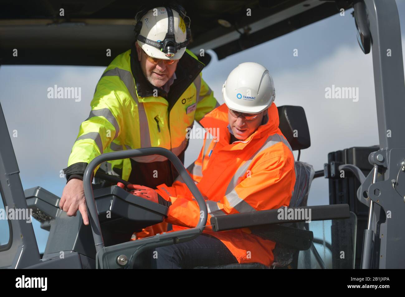 The Duke of Cambridge (right) operating an asphalt paver during a visit to the Tarmac National Skills and Safety Park in Nottinghamshire. Stock Photo