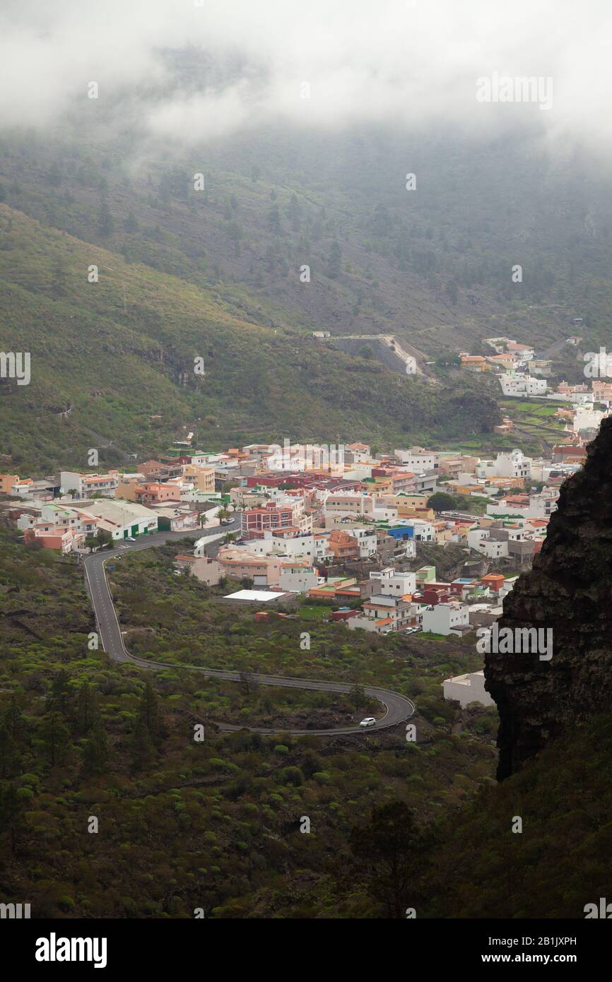 Looking down to the small village of Tamaimo set in the hillside near Los Gigantes, Tenerife, Spain. Stock Photo