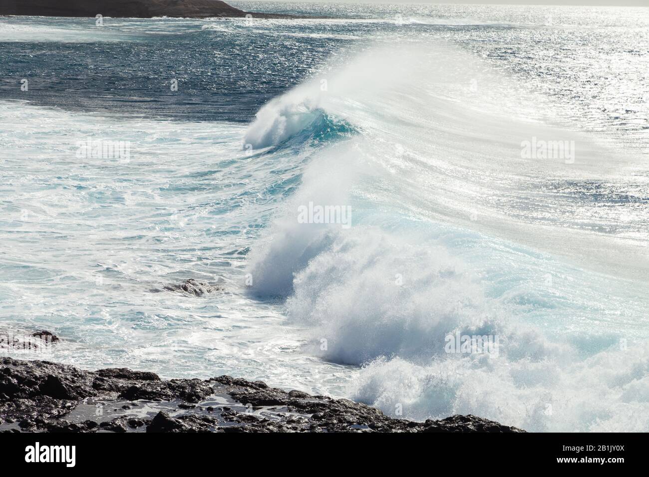 Waves breaking on the beach near Los Gigantes Tenerife. Stock Photo