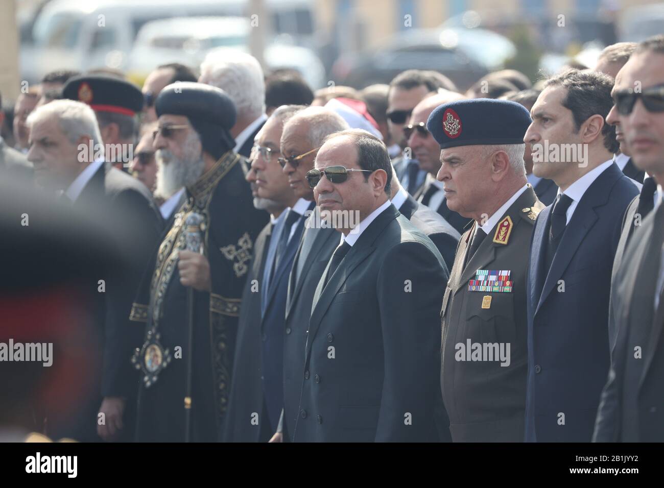 26 February 2020, Egypt, Cairo: (L-R) Former Egyptian Prime Minister Ibrahim Mahlab, Pope Tawadros II of Alexandria, Ahmad al-Tayyeb, Grand Imam of al-Azhar, Egyptian Prime Minister Mostafa Kamal Madbouly, Speaker of the Egyptian House of Representatives Ali Abdel Aal Egyptian President Abdel Fattah el-Sisi, Chief of Staff of the Armed Forces Lieutenant General Mohamed Farid Hegazy and Alaa Mubarak elder son of former Egyptian President Hosni Mubarak, take part in Mubarak's military funeral at El-Mosheer Tantawy mosque. Mubarak, who ruled Egypt for three decades, died on Tuesday in a Stock Photo