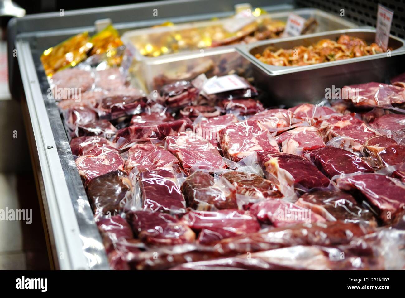 Beef, veal, lamb fresh raw steaks are packaged in vacuum and sold on