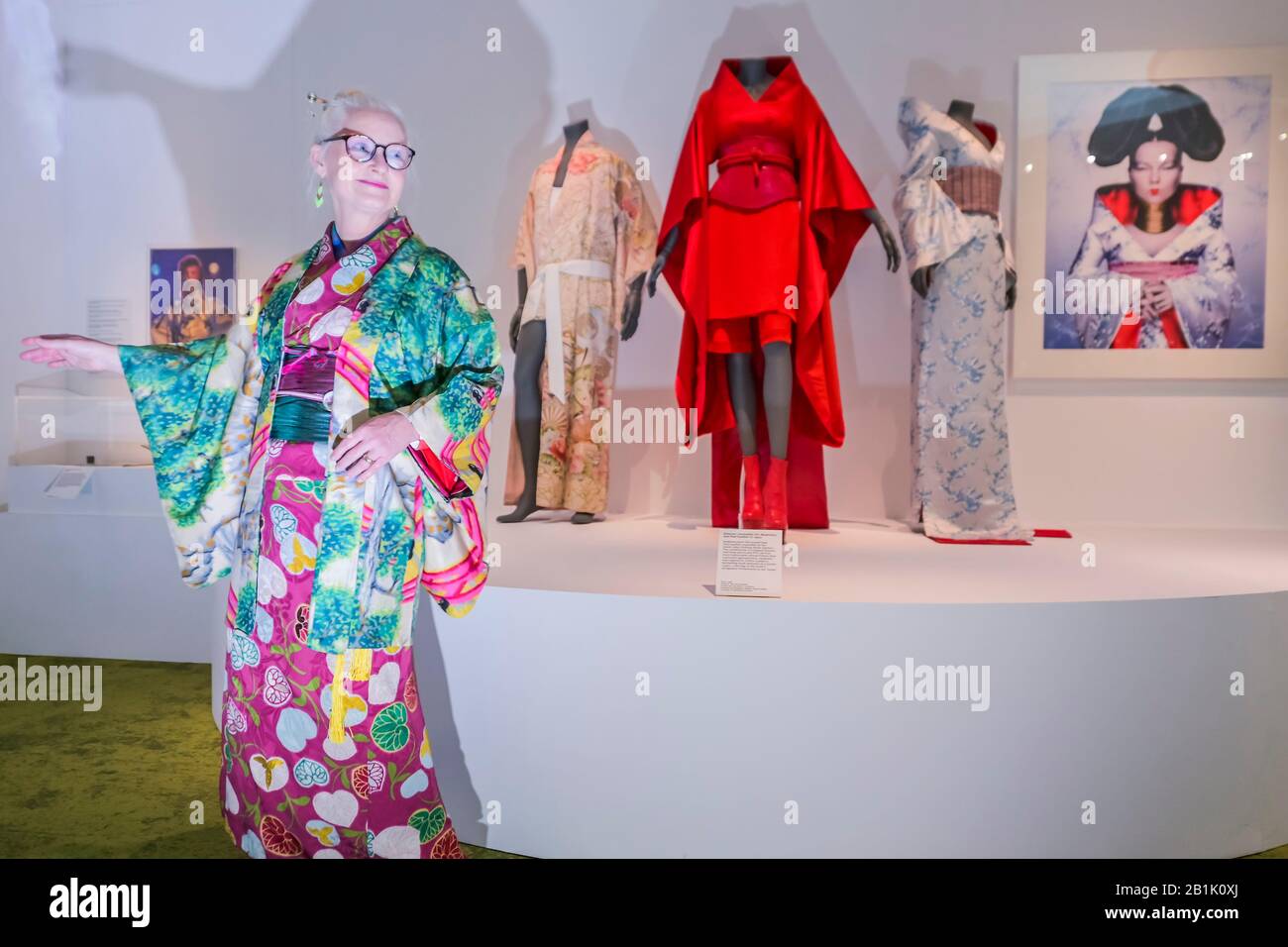 London, UK. 26th Feb, 2020. Cliffe (author of Sheila Kimono Style) poses with Kimonos made for Freddy Mercury, and Bjork - Kimono: Kyoto to Catwalk - a new exhibition at
