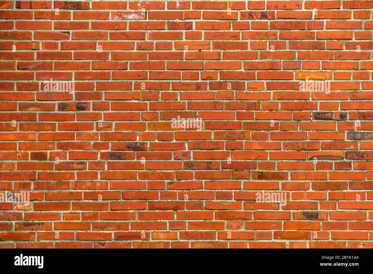 Red brickwall texture with clean lines and aged surface Stock Photo