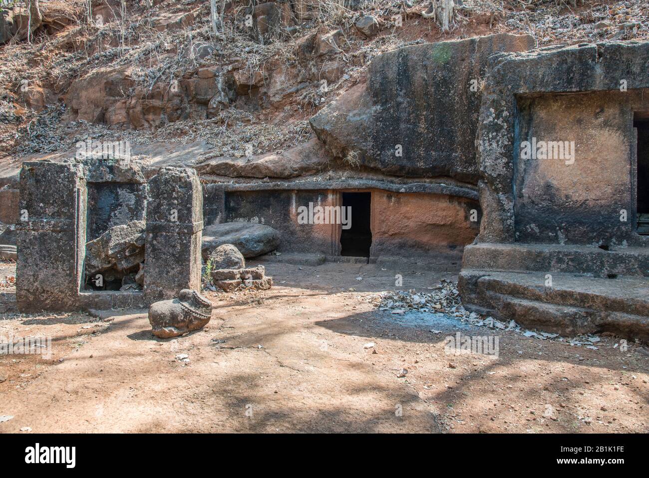 Panhale Kaji or Panhalakaji Caves, District- Sindhudurg, Maharashtra, India : General-View of Cave No. 25 at the background and a small monolithic shr Stock Photo