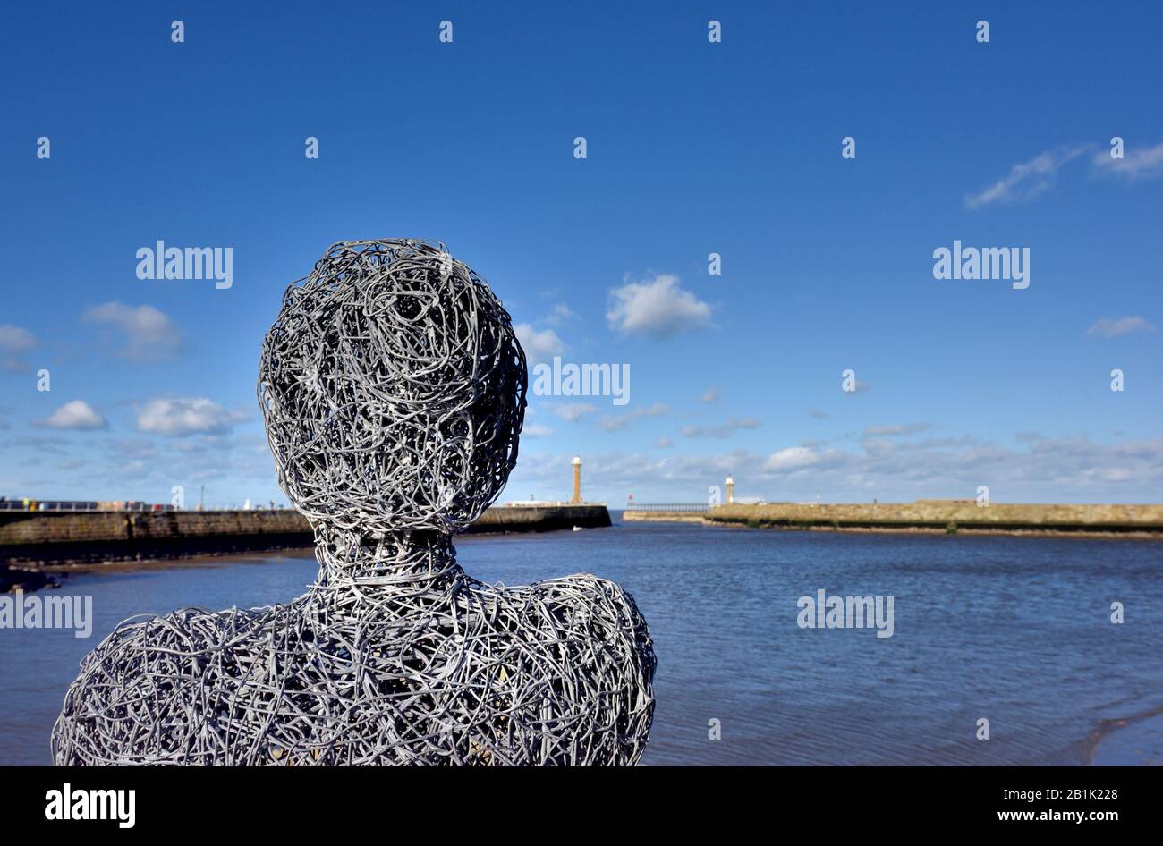 A whitby fisherlass sculpture,a tribute to the towns fishing families,Tate hill pier,Whitby,North Yorkshire,England,UK Stock Photo