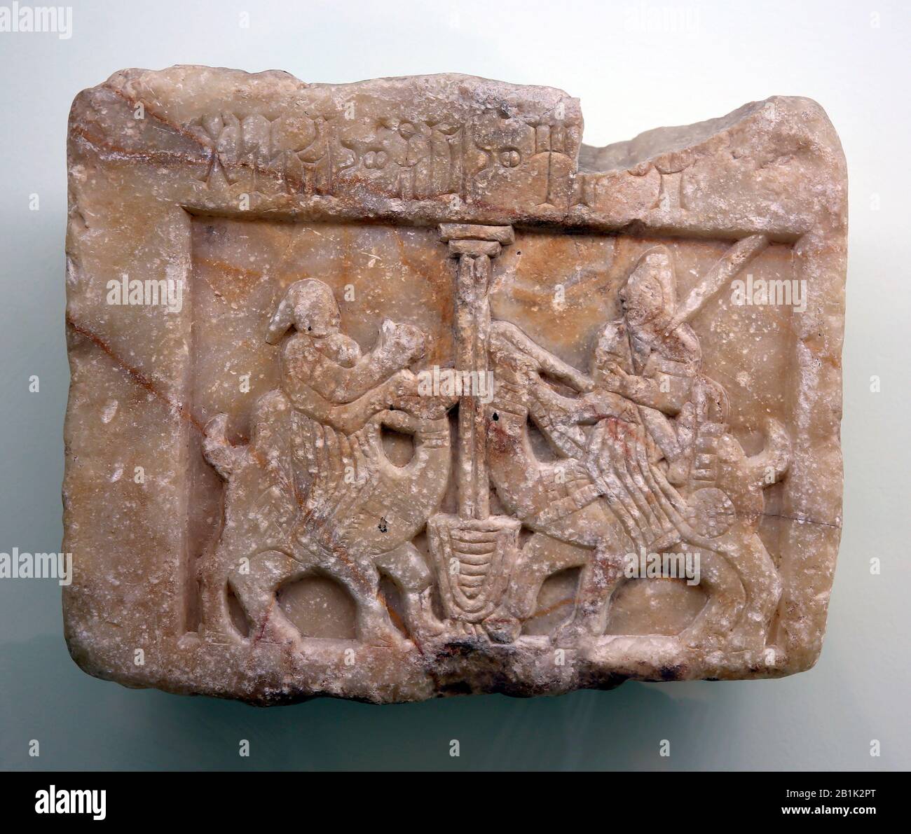 Pre-islamic cultures. Arabian Peninsula. Man and woman on camels at a well relief slab. Yemen. Istanbul Archaeological Museum. Turkey. Stock Photo