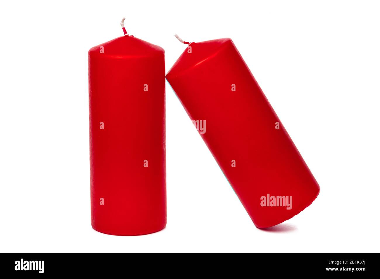 A selection of red candles on a white background Stock Photo Alamy