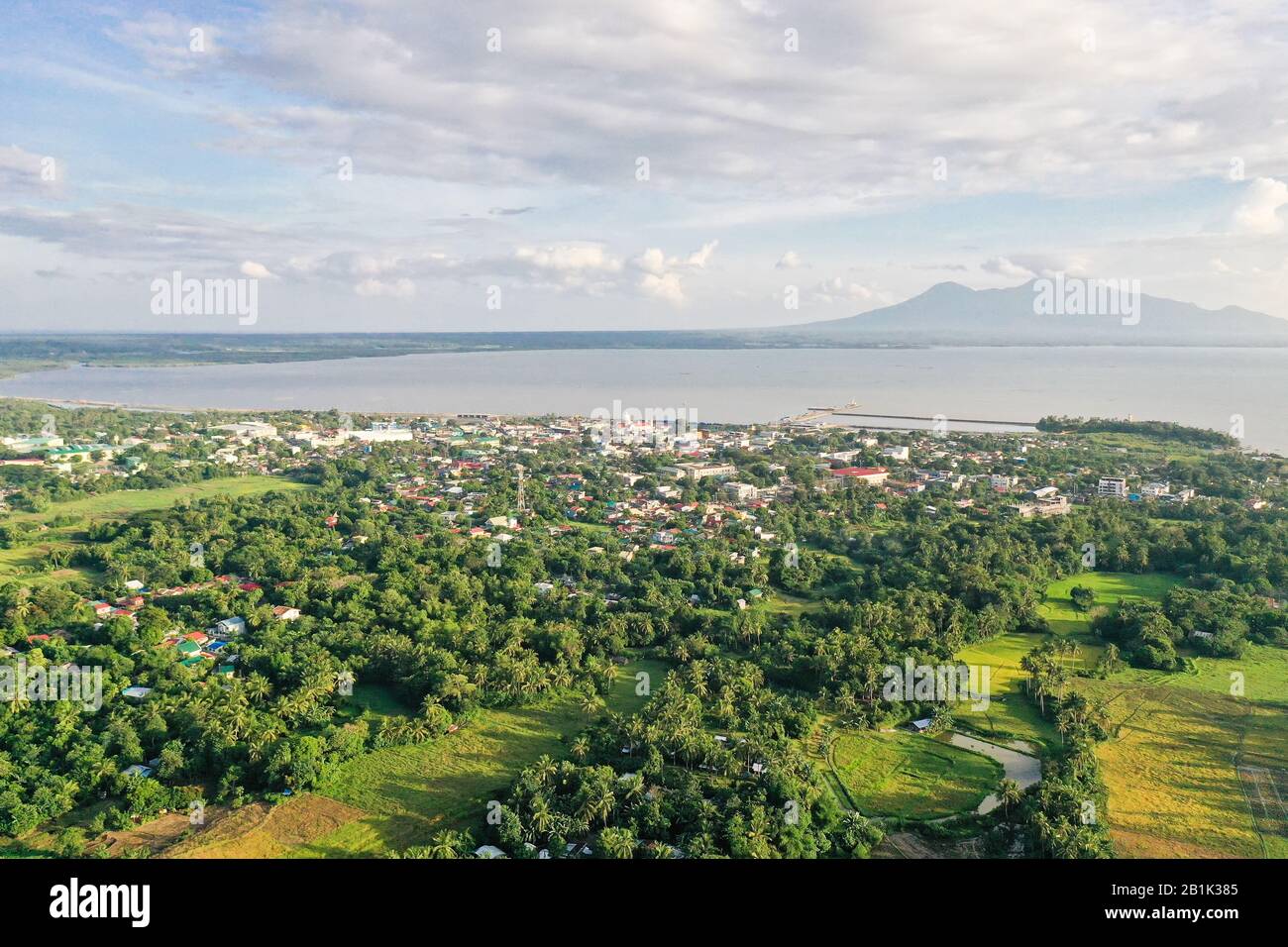 Sorsogon City, Luzon, Philippines. Town by the sea, top view. Landscape in Asia. Summer and travel vacation concept. View of a small town and a volcano in the distance. Stock Photo