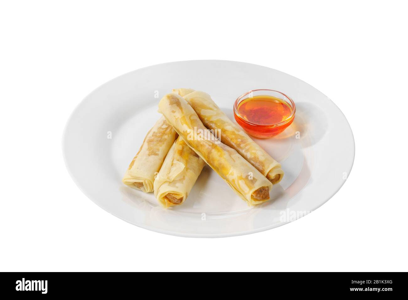Hot appetizer stuffed pancake on plate with hot red sauce, pepper, fried in oil before alcohol, white isolated background, side view Stock Photo