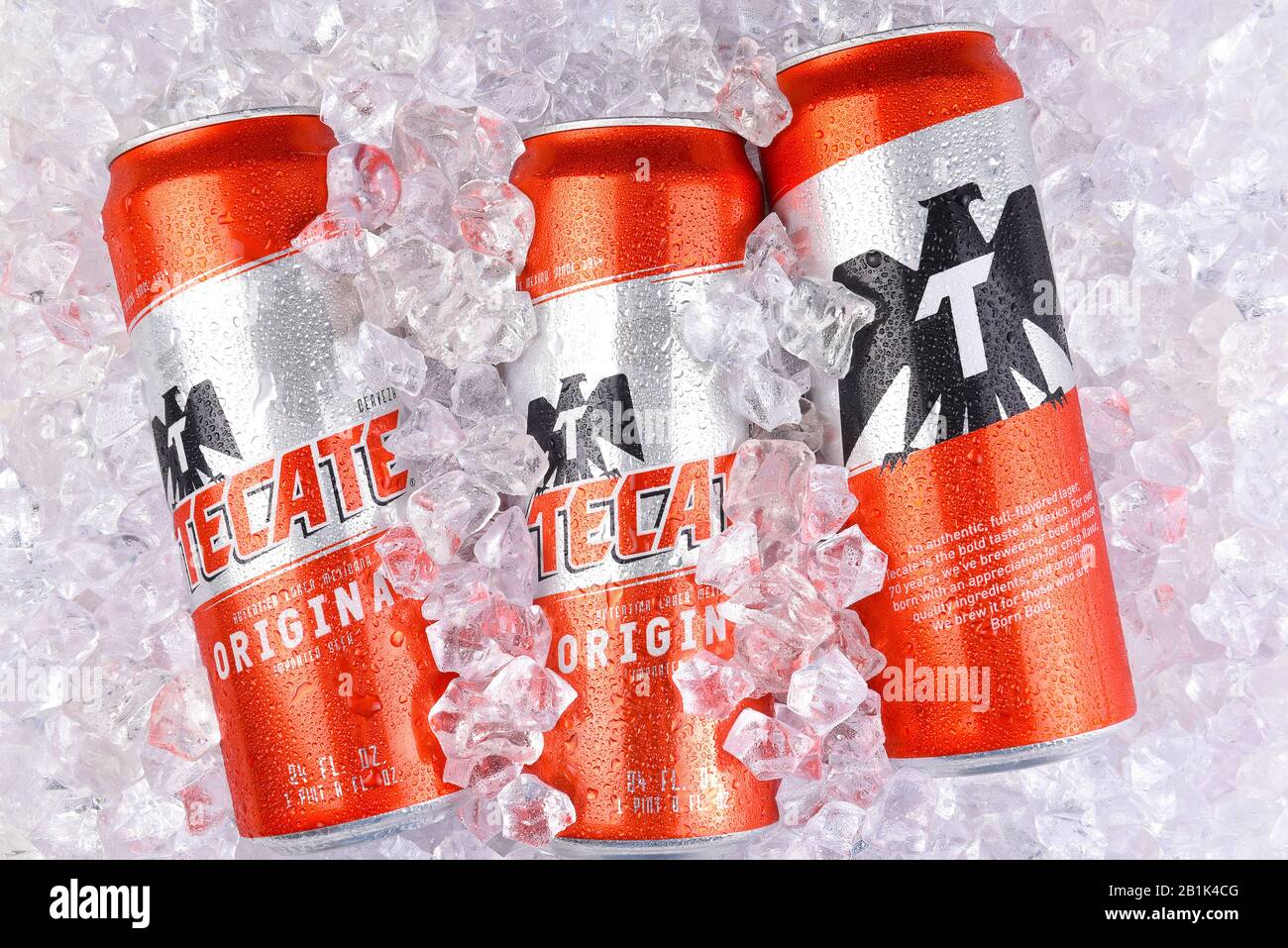 IRVINE, CALIFORNIA - MARCH 29, 2018: Three King Cans of Tecate Original beer in ice. Cuauhtemoc Moctezuma Brewery is a major brewer based in Monterrey Stock Photo