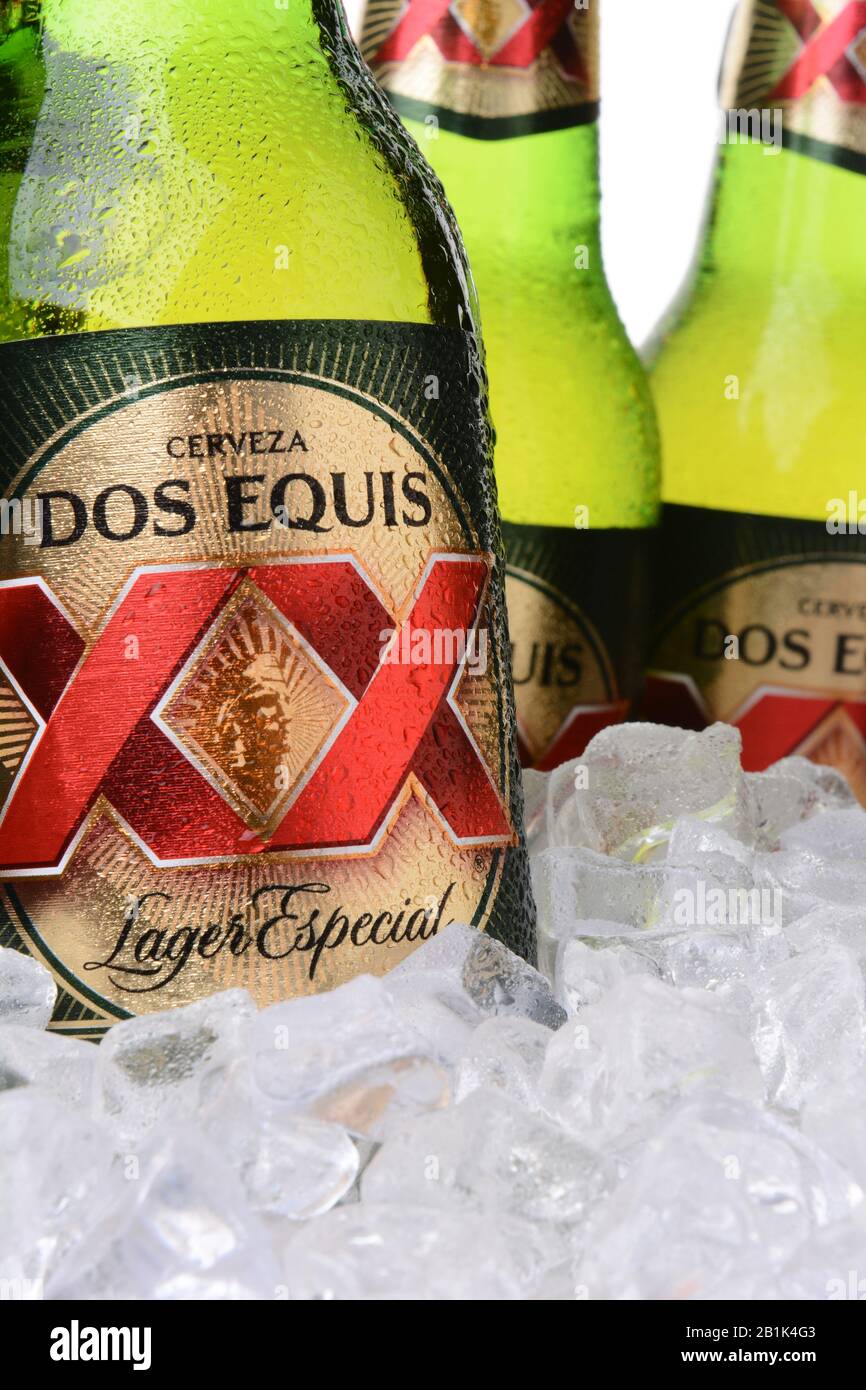 IRVINE, CA - MAY 30, 2014: Closeup of bottles of Dos Equis Lager Especial in ice. Founded in 1890 from the Cuauhtemoc-Moctezuma Brewery in Monterrey, Stock Photo
