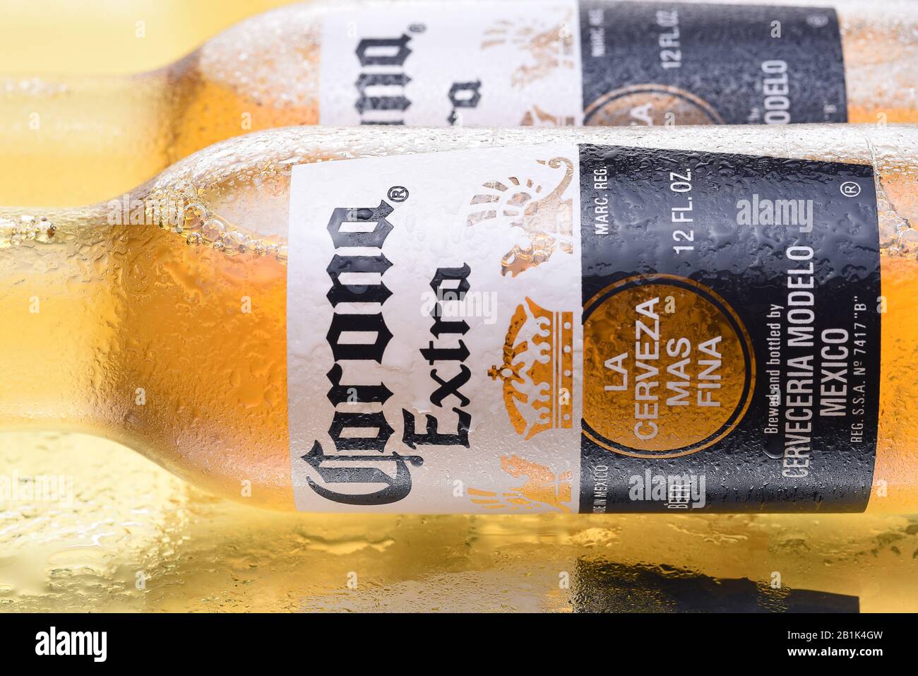 IRVINE, CALIFORNIA - MARCH 10,  2018: Corona Extra Bottles with condensation on a reflective surface. Corona is the most popular import in The USA. Stock Photo