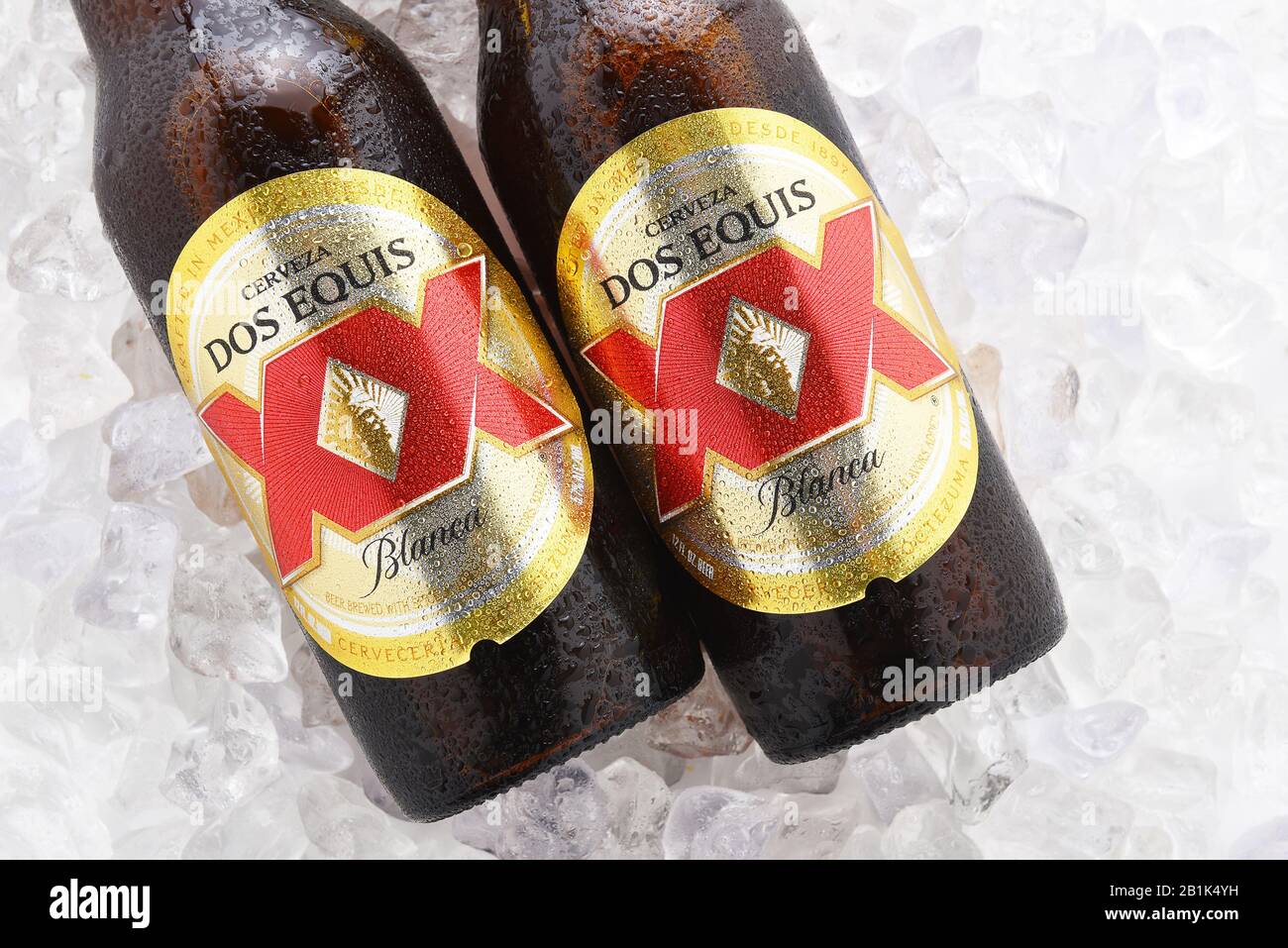 IRVINE, CA - JUNE 14, 2017: Dos Equis Blanca on ice. Two bottles of the wheat beer from Cuauhtemoc-Moctezuma Brewery in Monterrey, Mexico a subsidiary Stock Photo