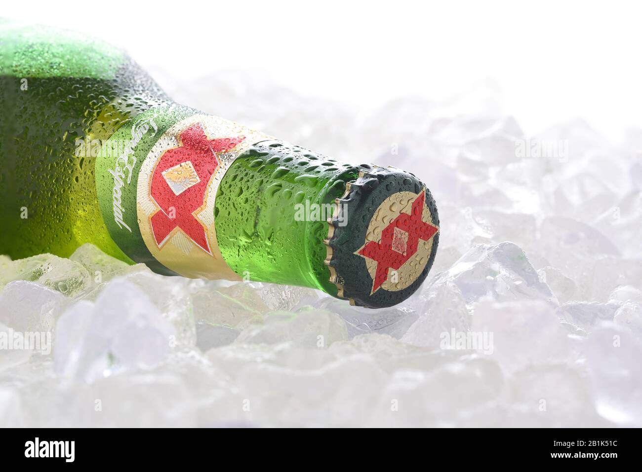 IRVINE, CA - JUNE 14, 2017: Dos Equis Blanca on ice. A single bottle of the popular beer from Cuauhtemoc-Moctezuma Brewery in Monterrey, Mexico a subs Stock Photo
