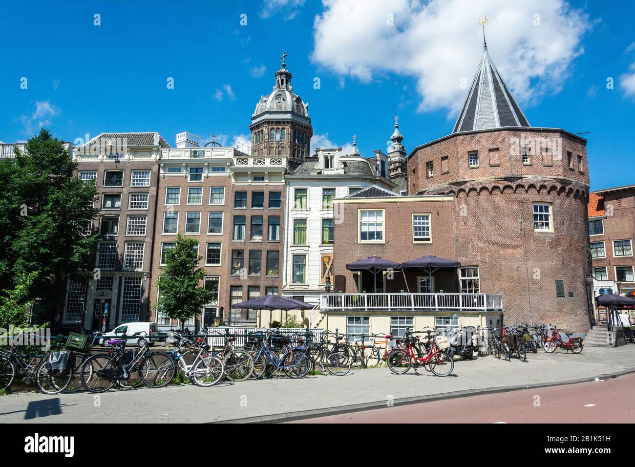 Amsterdam, The Netherlands – June 22, 2016.  Street view in Amsterdam, with the Schreierstoren tower, surrounding buildings and commercial properties. Stock Photo