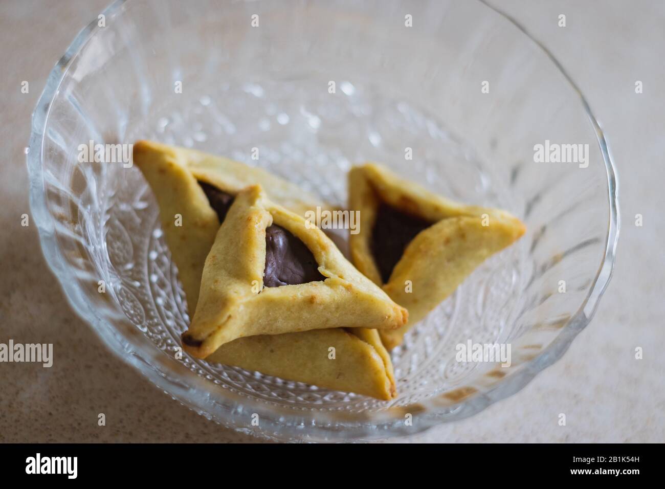 Hamantaschen. (ozeney haman) Triangular pastry of crispy dough, stuffed with poppy or halva or chocolate. For the Jewish holiday Purim. Home baking, i Stock Photo